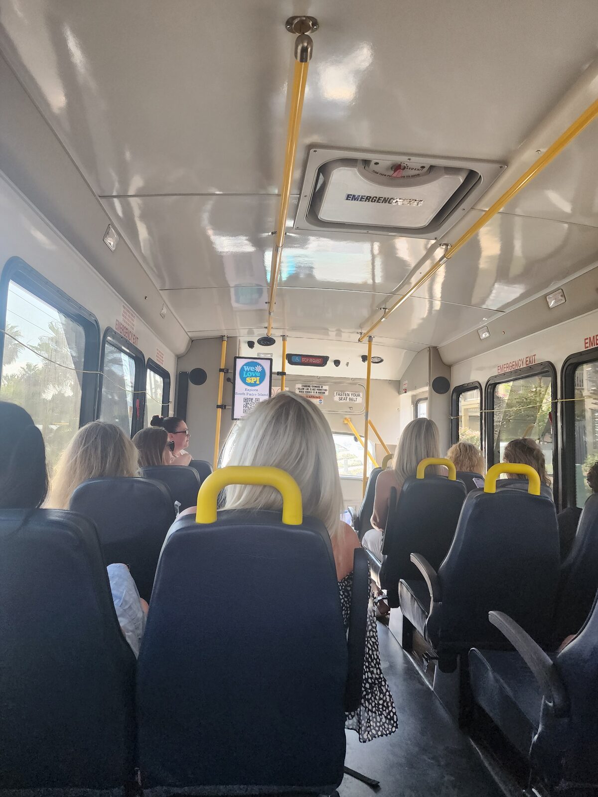Passengers seated inside an Island Metro bus.