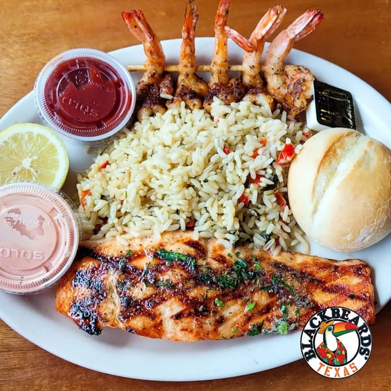 Charbroiled Atlantic salmon with blackened shrimp at Blackbeards' Restaurant