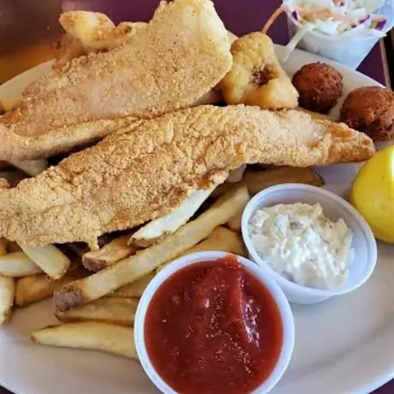 Fried Asian catfish with fries, hush puppies and coleslaw at Blackbeards' Restaurant