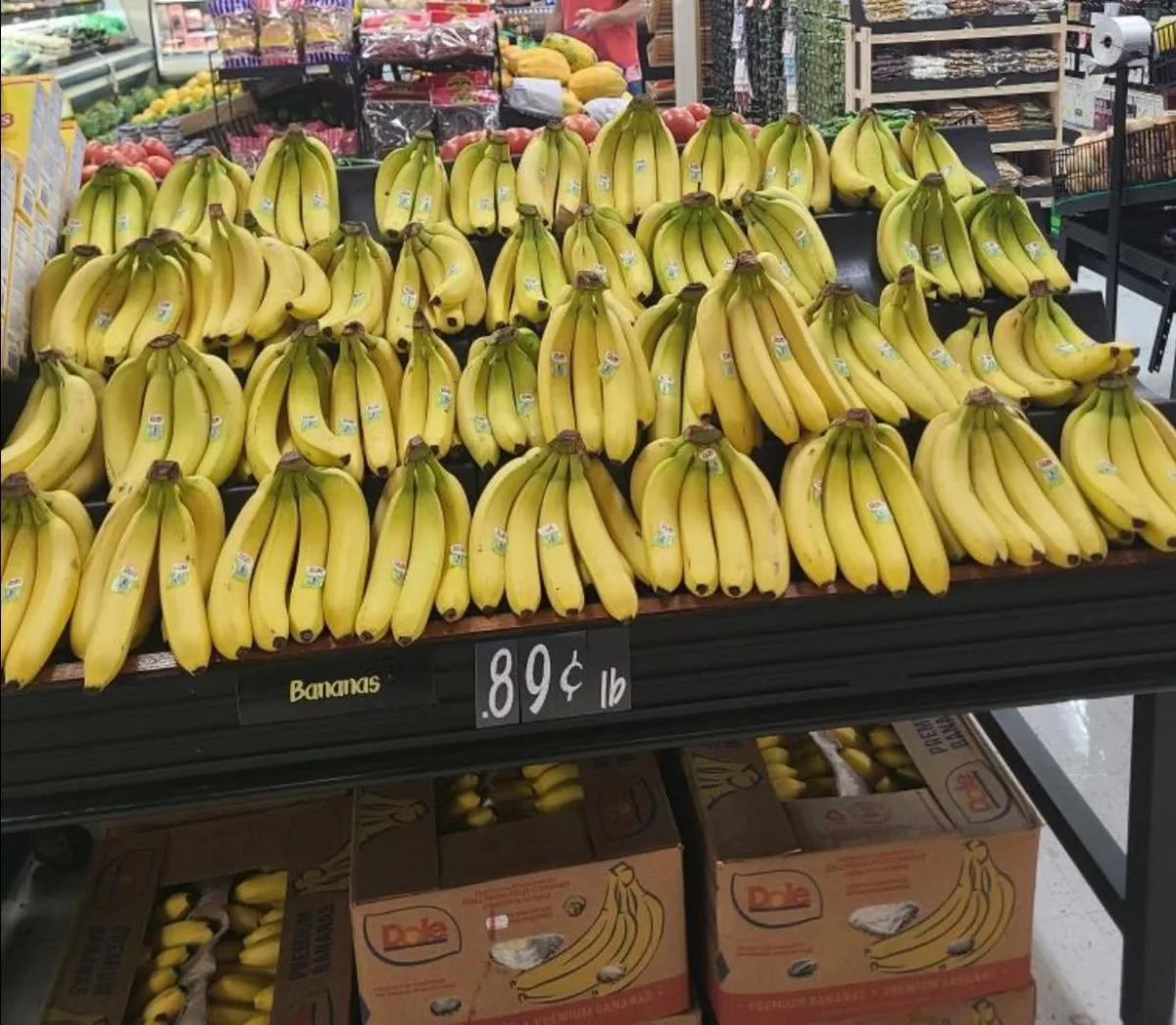 A long display of bunches of bananas