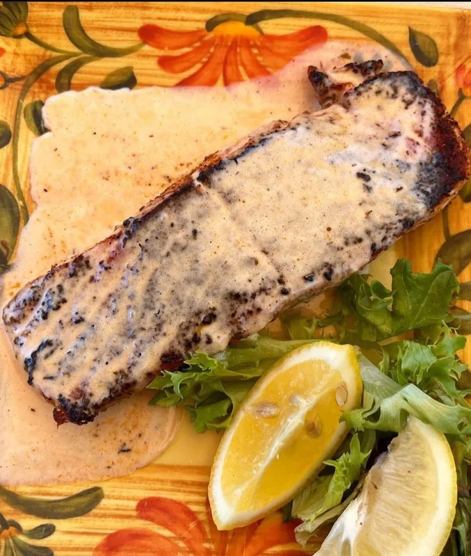 Blackened Salmon Fillet with white wine cream sauce at Palms Resort & Cafe on the Beach