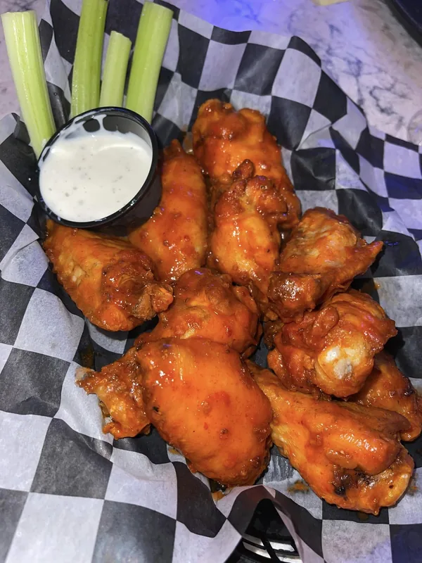 Chicken Wings with celery and ranch at Tequila Sunset